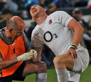 England's Mike Brown receives some treatment