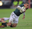 South Africa's Bryan Habana is hauled down by the England defence