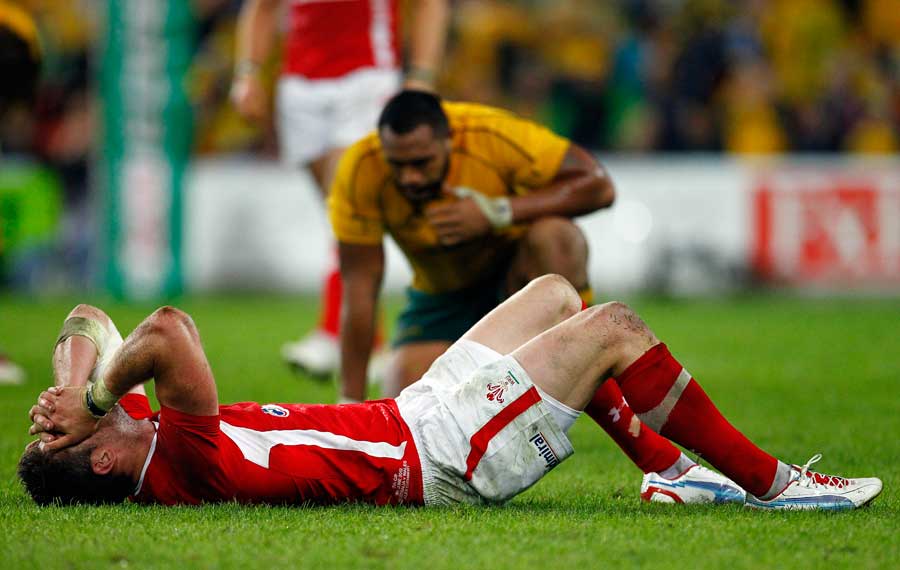 Wales winger Alex Cuthbert gets to grips with defeat