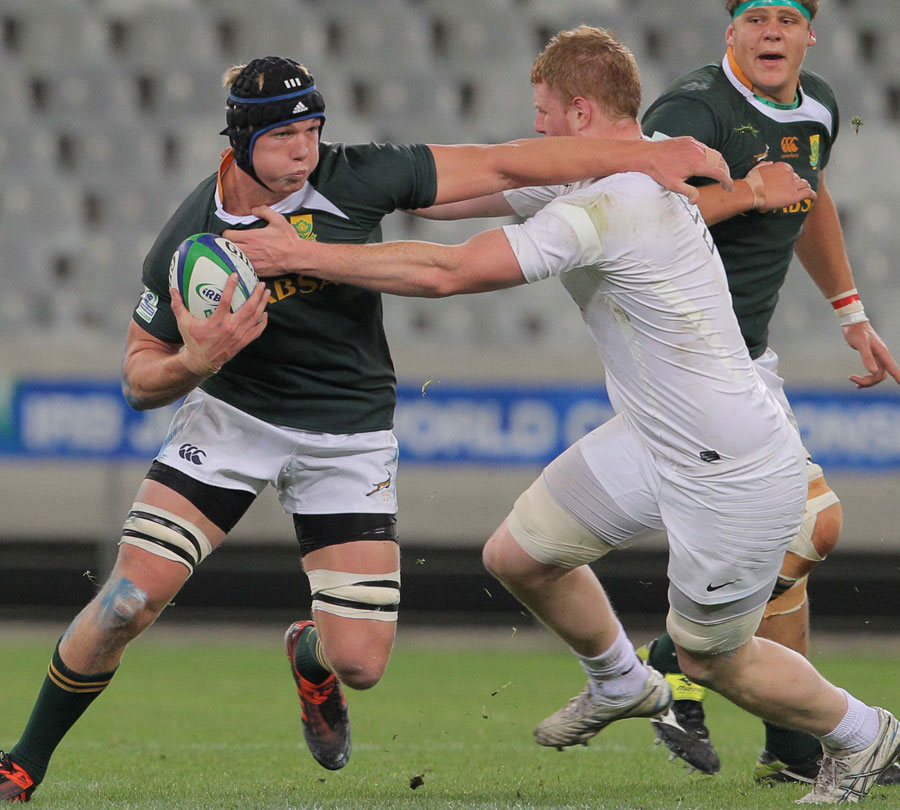 South Africa's Pieter-Steph du Toit shrugs off the England defence