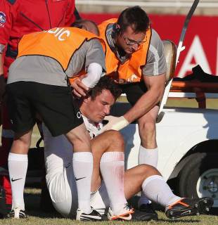 England's George Lowe receives some attention, SA Barbarians (South) v England, Kimberley, South Africa, June 13, 2012