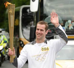 Former Scotland international Chris Paterson carries the Olympic Flame, Scotland, June 14, 2012