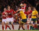 Wales' Leigh Halfpenny is caught by Cooper Vuna