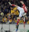 Rhys Priestland and Digby Ioane contest the ball