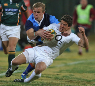 England's Anthony Allen is tackled by the SA Barbarians' Joubert Engelbrecht, SA Barbarians (North) v England, Olen Park, Potchefstroom, South Africa, June 19, 2012