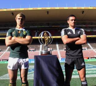 South Africa's Wian Liebenberg and New Zealand's Bryn Hall pose with the Junior World Championship trophy