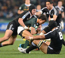 South Africa's Dillyn Leyds is shackled by the New Zealand defence