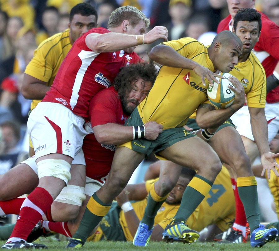 Australia's Will Genia stretches the Wales defence