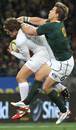 South Africa's Wynand Olivier tussles with Alex Goode