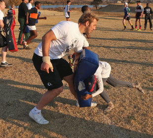 England's Chris Robshaw helps out at a coaching clinic