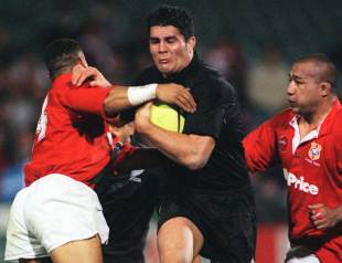 The All Blacks Troy Flavell breaks through the Tongan defence, Auckland, New Zealand, June 16, 2000