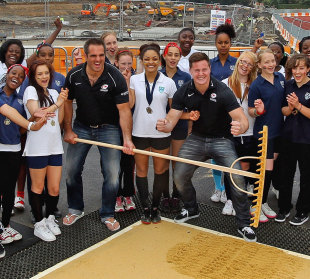 Saracens' Andy Saull and Justin Melck pose with girls from Copthall School, New Barnet Copthall Stadium, England, July 2, 2012