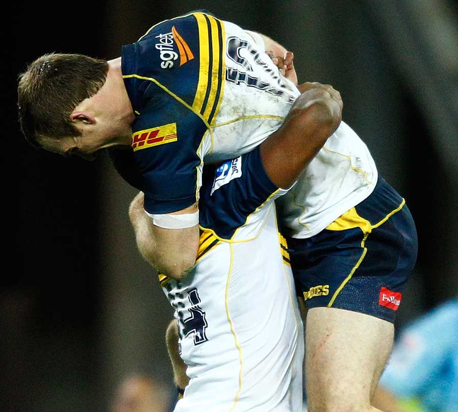 The Brumbies celebrate their win over the Waratahs