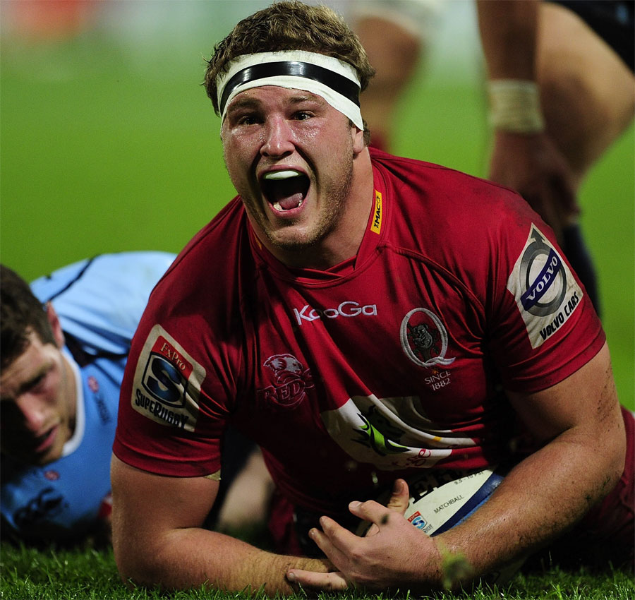 James Slipper celebrates the Reds' third try of the night