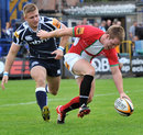 London Welsh's Chris Banfield runs in a try against Sale Sharks.