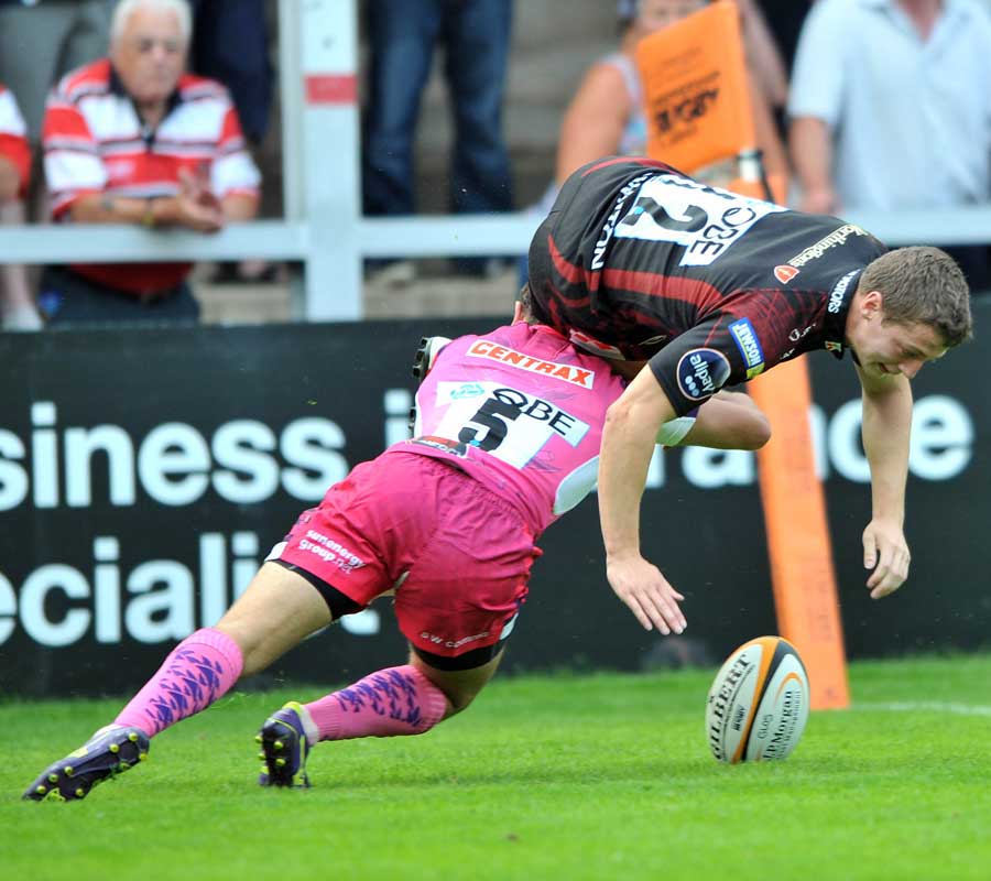 Gloucester's Ian Clark is chopped down by an Exeter defender
