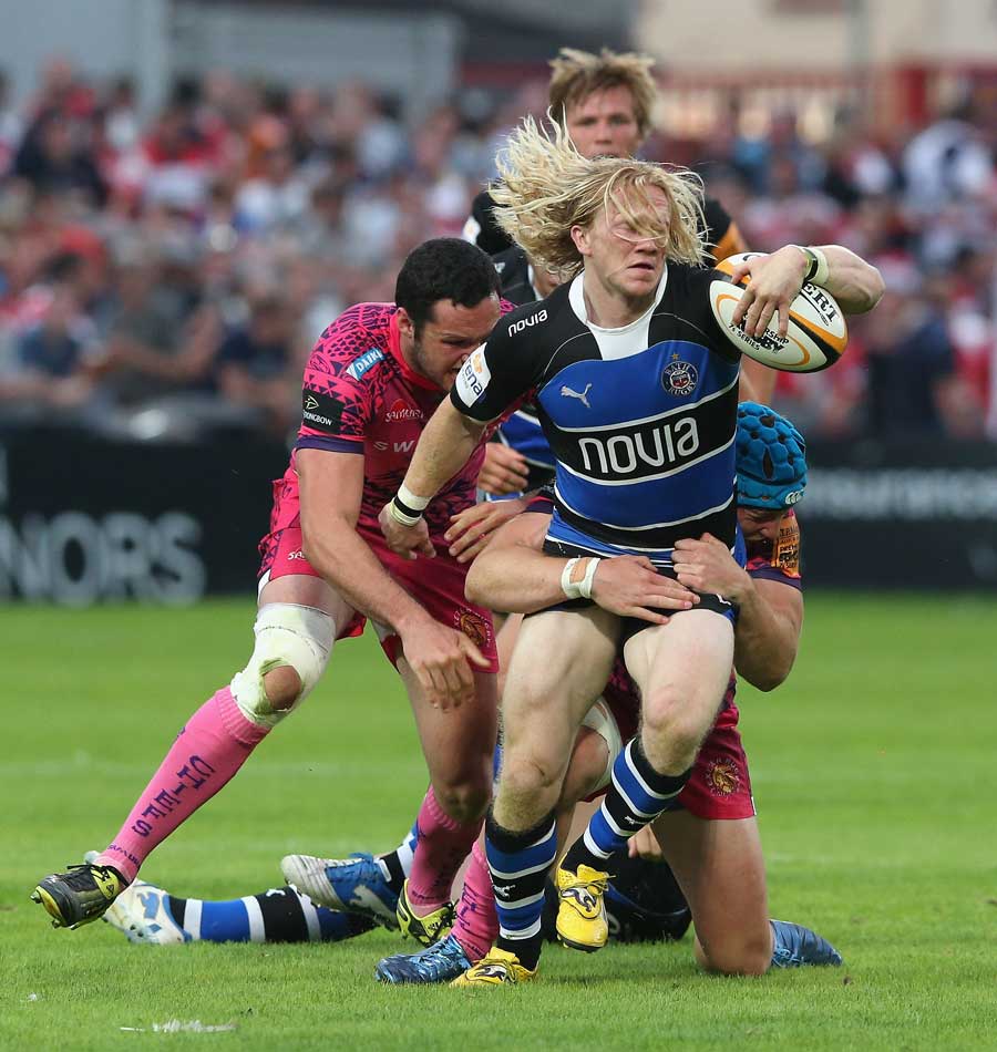 Bath's Tom Biggs wrestles with the Exeter defence