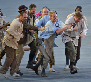 Actors play rugby during the opening ceremony for the 2012 Olympic Games