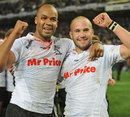 The Sharks' JP Pietersen and Frederic Michalak celebrate victory