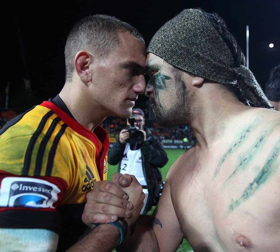 Chiefs fly-half Aaron Cruden celebrates victory with a Maori warrior