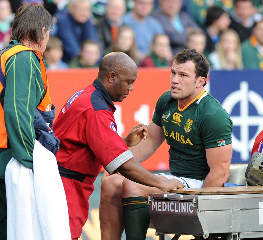 South Africa hooker Bismarck du Plessis is helped from the field
