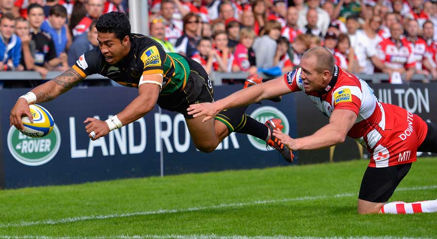 Northampton's George Pisi dives for the line