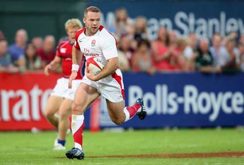 Ollie Phillips of England Sevens runs in a try