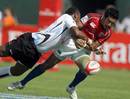 Fiji's Sailosi Rabonaqica tackles Nese Malif of the USA