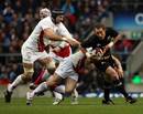 New Zealand's Jimmy Cowan is tackled by England's Steve Borthwick