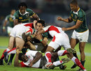 South Africa's Robert Ebersohn is tackled