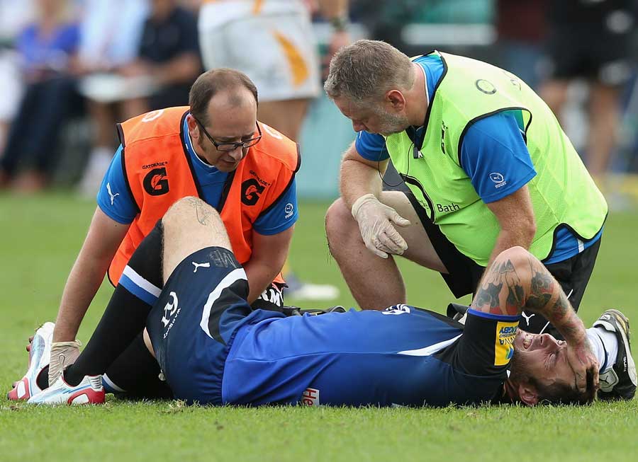 Matt Banahan receives on-field treatment for a knee injury