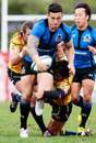 The Wild Knights' Sonny Bill Williams stretches the Shining Arcs' defence