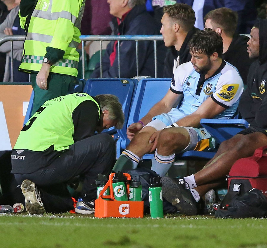Northampton's Ben Foden receives treatment for an ankle injury