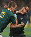 South Africa's Johan Goosen fends off New Zealand's Aaron Smith
