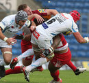 London Welsh's Jonathan Mills feels the force of a collision with Tom Johnson