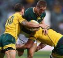 South Africa's Johan Goosen takes the ball into contact