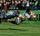 London Irish's Ofisa Treviranus beats the tackle of Worcester's Chris Pennell to score