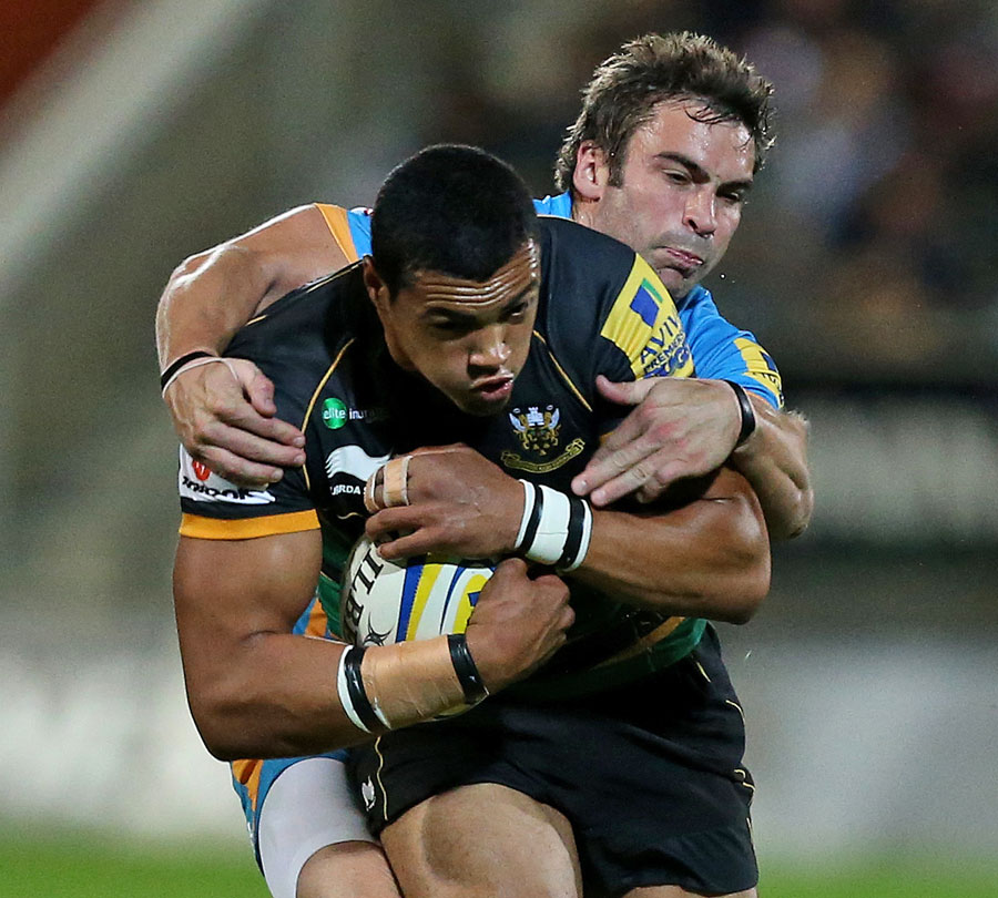 Wasps' Nicky Robinson attempts to shackle Northampton's Luther Burrell
