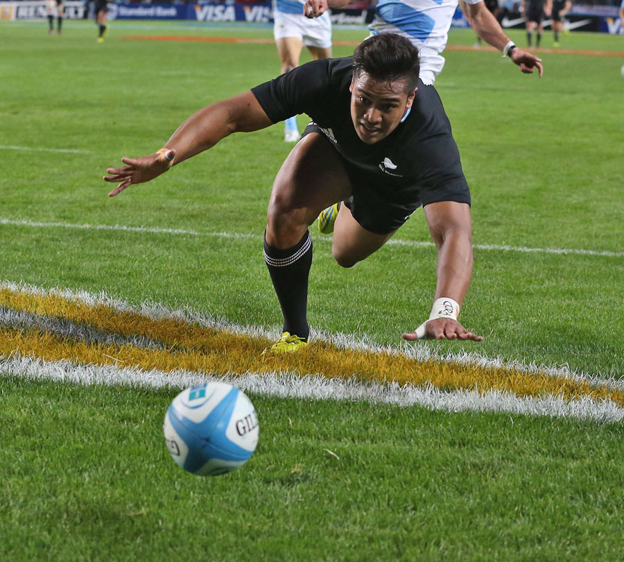 New Zealand's Julian Savea closes in on the ball to claim a score