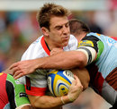 Saracens' Chris Wyles is hit by Quins defenders