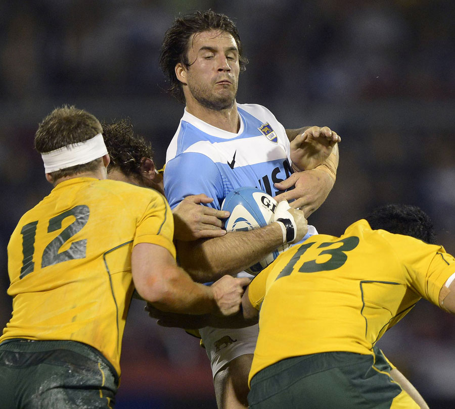 Argentina's Marcelo Bosch is shackled by Australia's defence