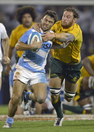 Argentina's Martin Landajo is tackled by Australia's Scott Higginbotham, Argentina v Australia, Rugby Championship, Gigante de Arroyito, Rosario, Argentina., October 6, 2012