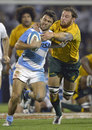 Argentina's Martin Landajo is tackled by Australia's Scott Higginbotham