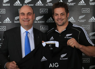 New Zealand skipper Richie McCaw and AIG executive vice president Peter Hancock poses with the new All Blacks shirt, Viaduct Events Centre, Auckland, New Zealand, October 12, 2012