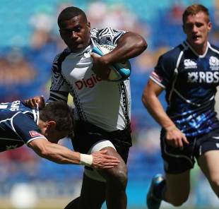 Fiji's Samisoni Nasagavesi bursts through a Scottish tackle