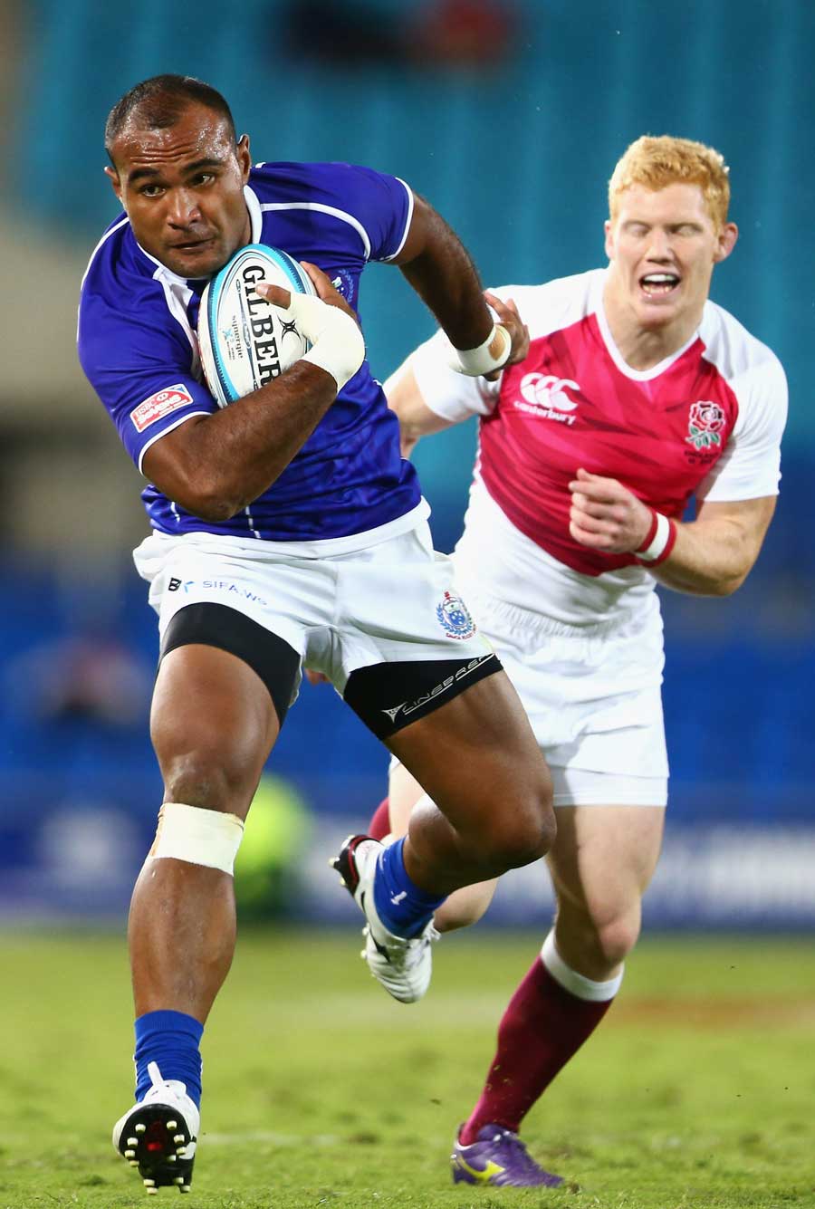 Samoa's Faalemiga Selesele breaks clear of the England defence