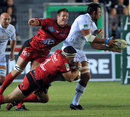 Toulon's Bakkies Botha and Andrew Sheridan tackle Montpellier's Mickael Demarco 