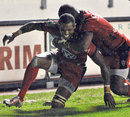 Toulon's Delon Armitage is embraced after scoring