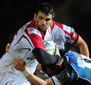 Ulster's Jared Payne fends off a Glasgow tackler