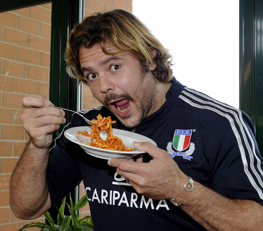 Italy's Andrea Lo Cicero tucks into some pasta